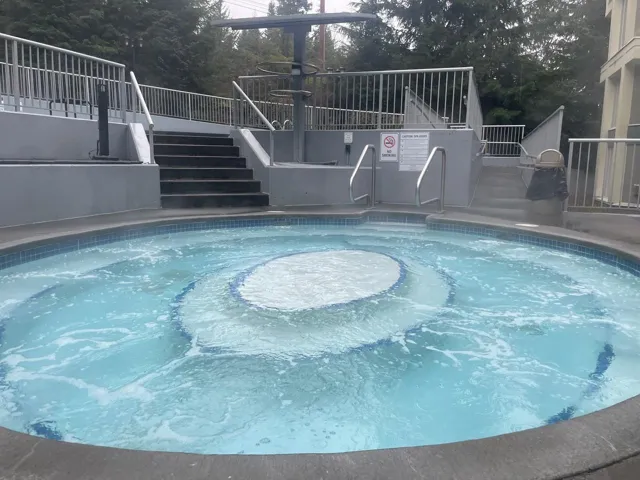 View of swimming pool with stairway and a swimming pool