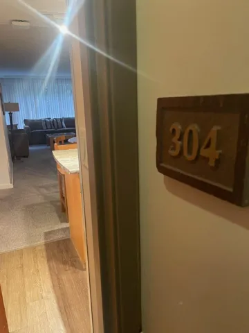 Detailed view of carpet flooring and wood finished floors