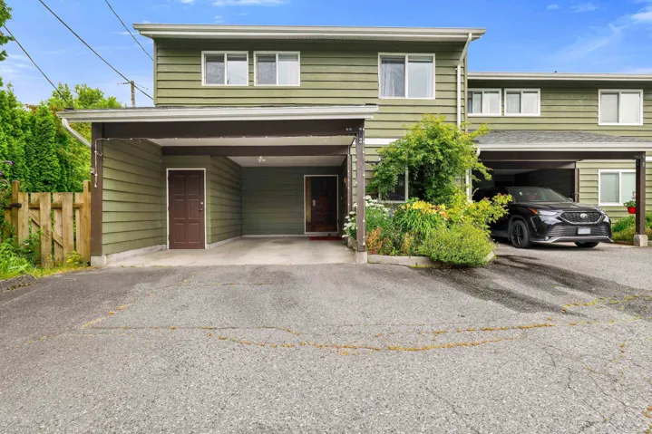 Multi-level exterior with horizontal siding and multiple windows
