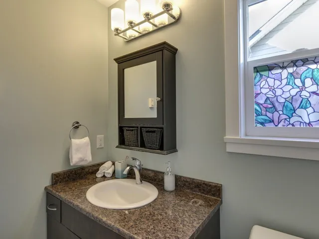 Bathroom with vanity and healthy amount of natural light