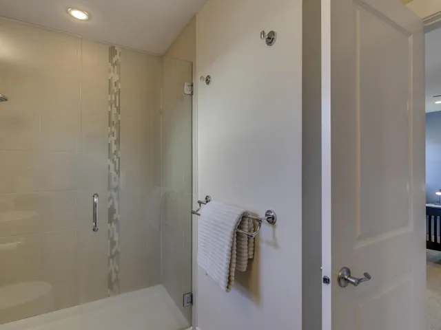 Full bathroom featuring a shower stall and recessed lighting