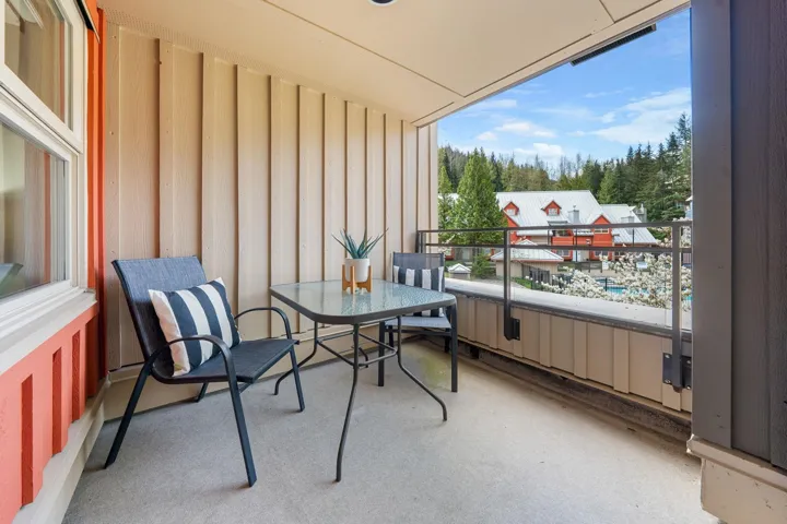 Covered outdoor balcony with concrete flooring