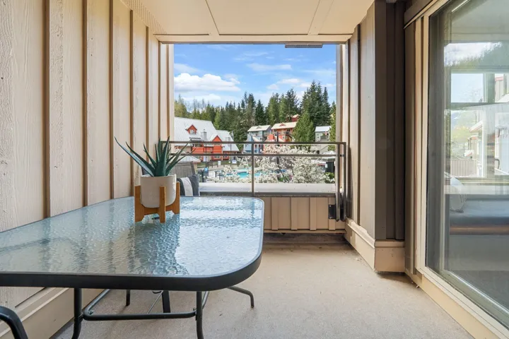 Private balcony featuring durable exterior siding, concrete flooring, and a metal railing