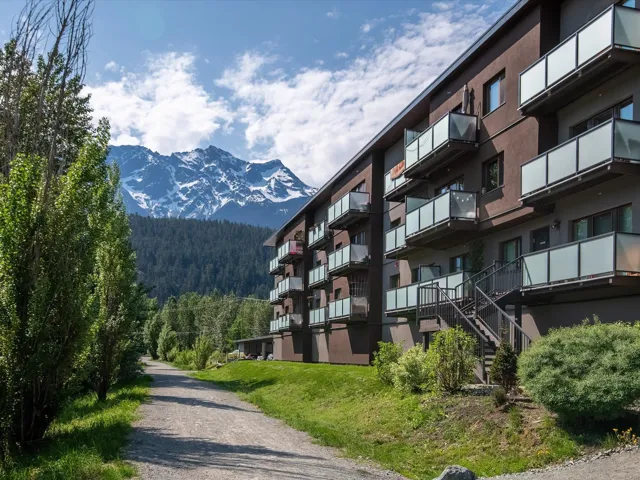 Exterior space featuring a wooded view and a mountain view