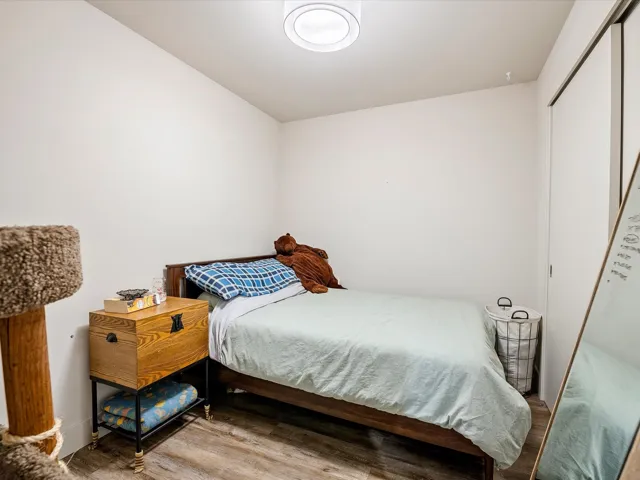 Bedroom featuring a closet and wood finished floors