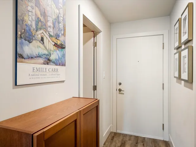 Doorway featuring wood finished floors