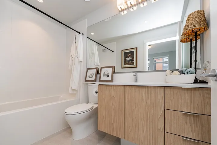 Full bath featuring toilet, shower / bath combo, vanity, tile patterned floors, and recessed lighting