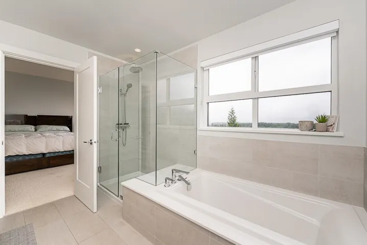 Ensuite bathroom with a stall shower, a garden tub, and tile patterned flooring