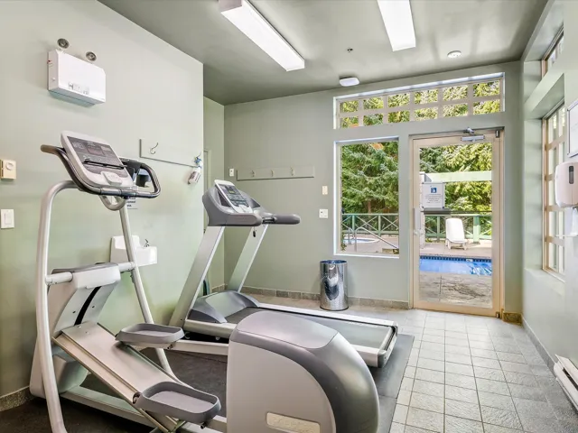 Workout room with a baseboard radiator