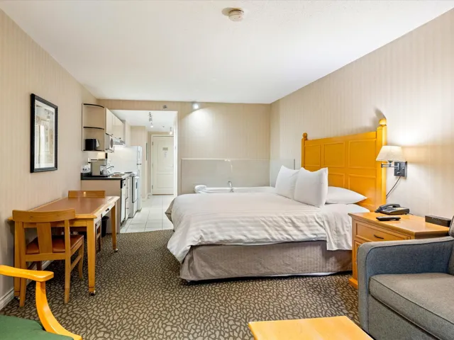 Bedroom featuring wallpapered walls