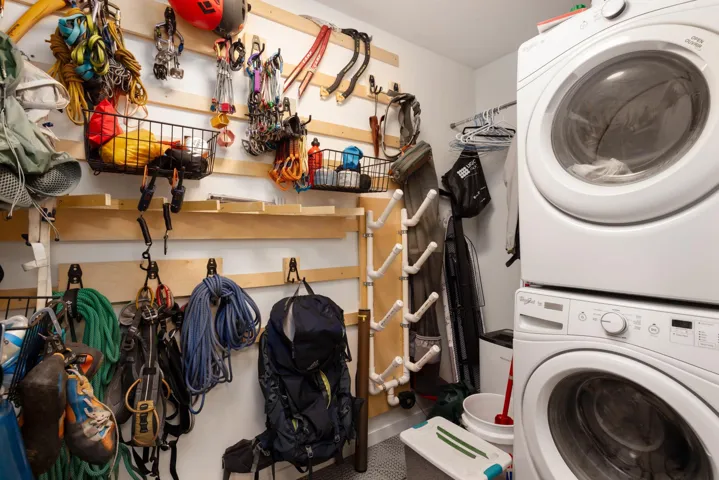 Laundry area with stacked washer / dryer