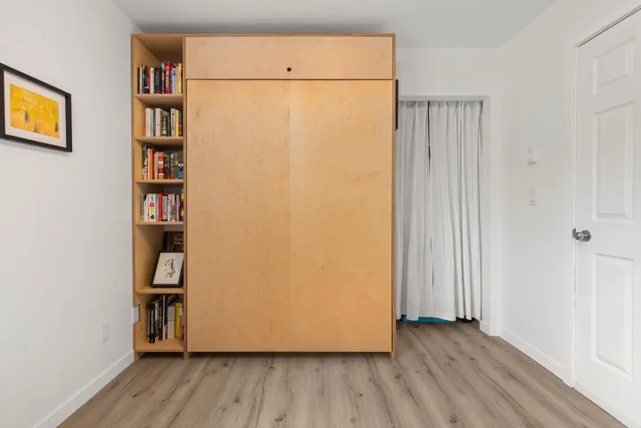 Unfurnished bedroom featuring light wood-type flooring
