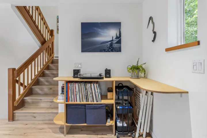 Staircase featuring wood finished floors