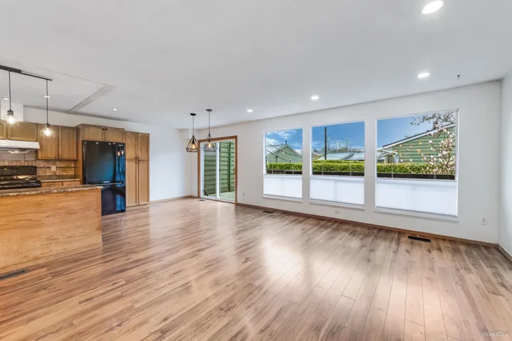 Unfurnished living room with recessed lighting, light wood-style flooring, baseboards, and visible vents