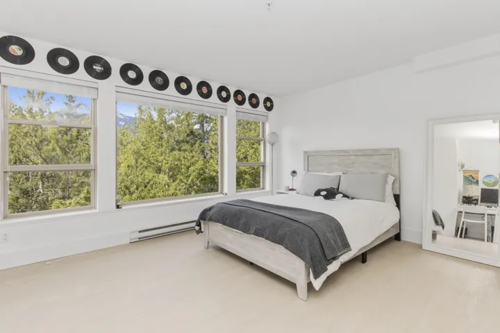Bright room with expansive windows offering abundant natural light. Located on lower level