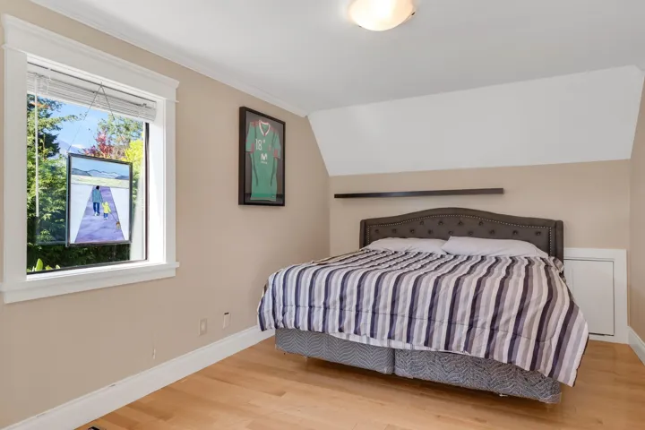 Bedroom featuring wood finished floors and ornamental molding
