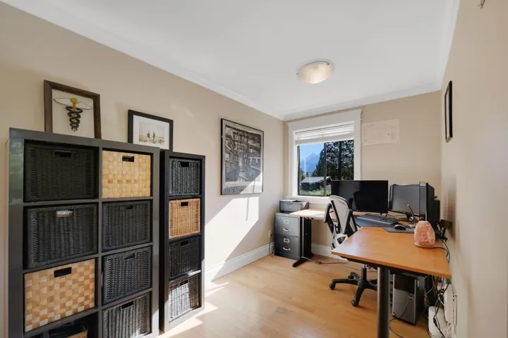 Home office featuring light wood-style flooring and ornamental molding