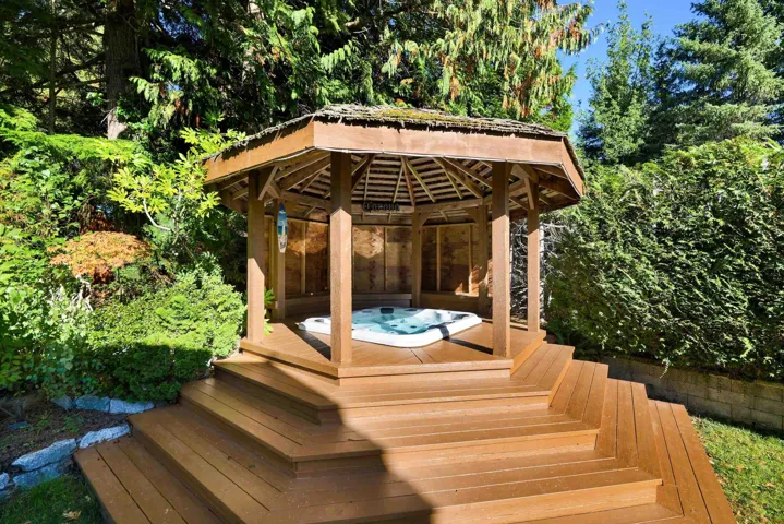 Wooden terrace featuring a gazebo