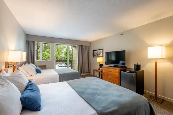 Bedroom featuring fridge and access to exterior