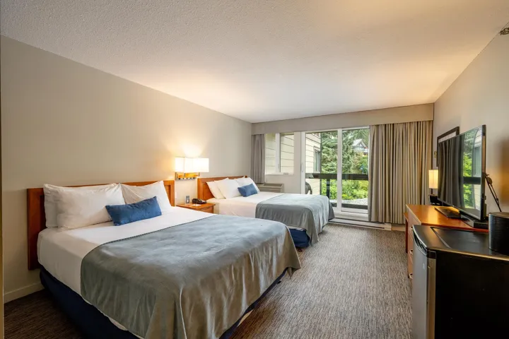 Bedroom with dark carpet and access to exterior