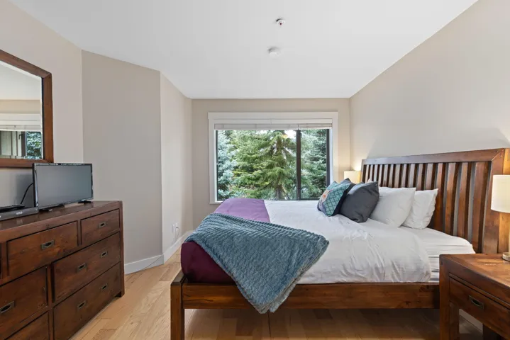 Bedroom with light wood-type flooring and baseboards