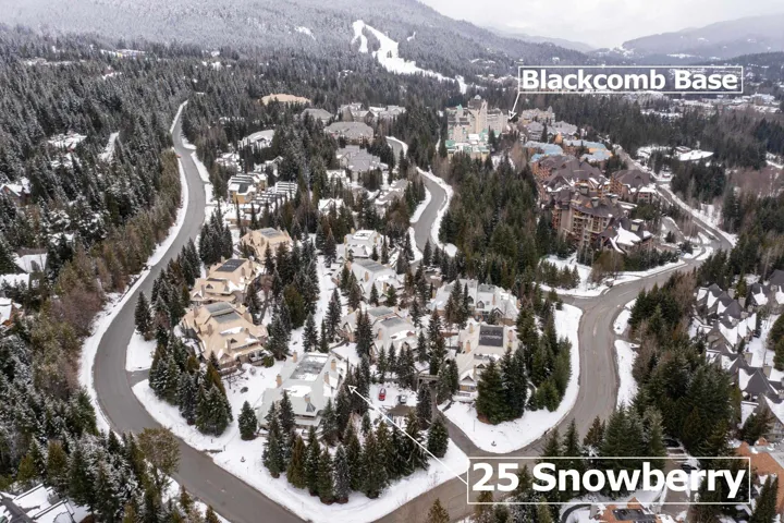 Snowy aerial view featuring a mountain view