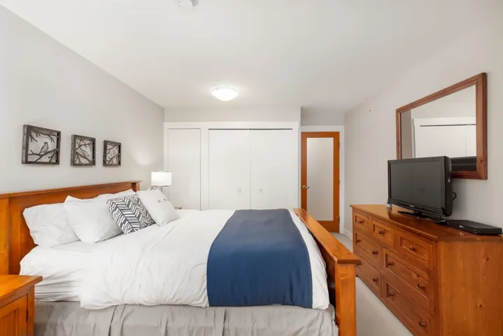Bedroom featuring multiple closets