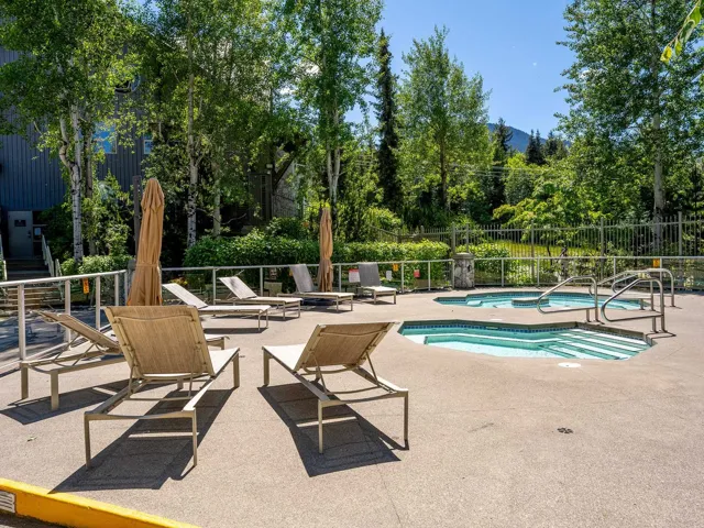 View of swimming pool featuring a community hot tub, a patio, and a swimming pool