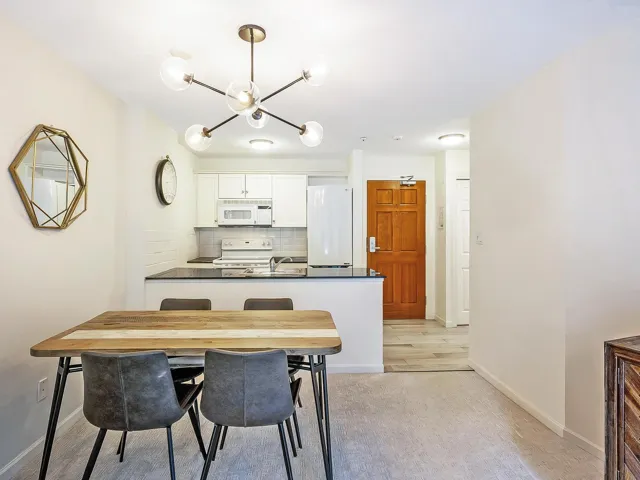 Dining space featuring a chandelier and light wood-style floors