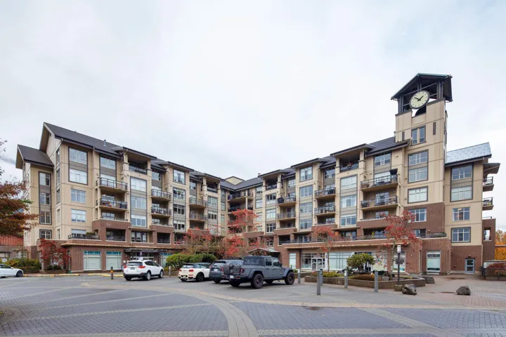 View of property with uncovered parking