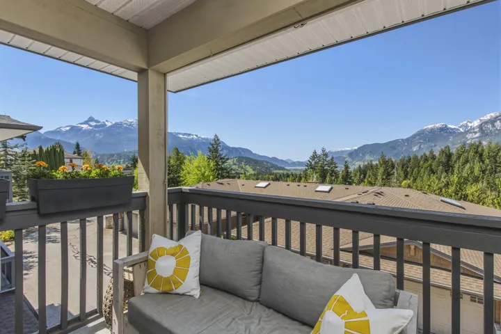 Covered balcony with mountain and forest scenery