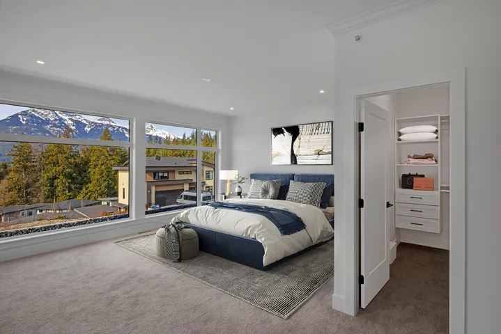 Carpeted bedroom featuring crown molding and recessed lighting