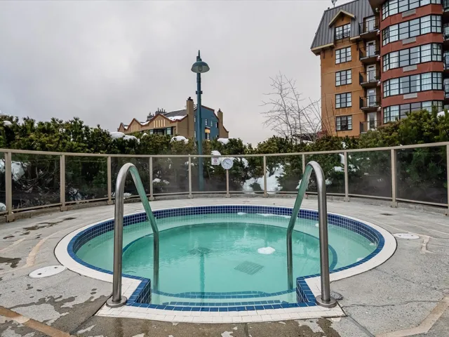 View of pool featuring a community hot tub