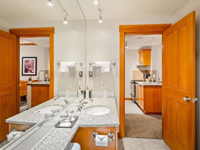 Bathroom featuring vanity and backsplash