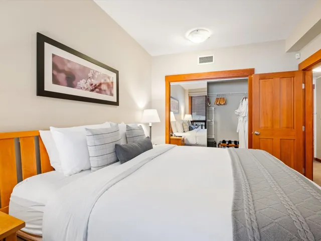 Bedroom featuring visible vents and a closet