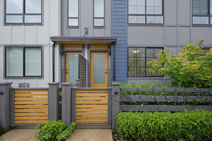 Modern multi-story facade featuring board and batten siding and distinct architectural lines