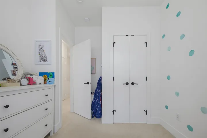 Room featuring a window with horizontal blinds, providing natural light
