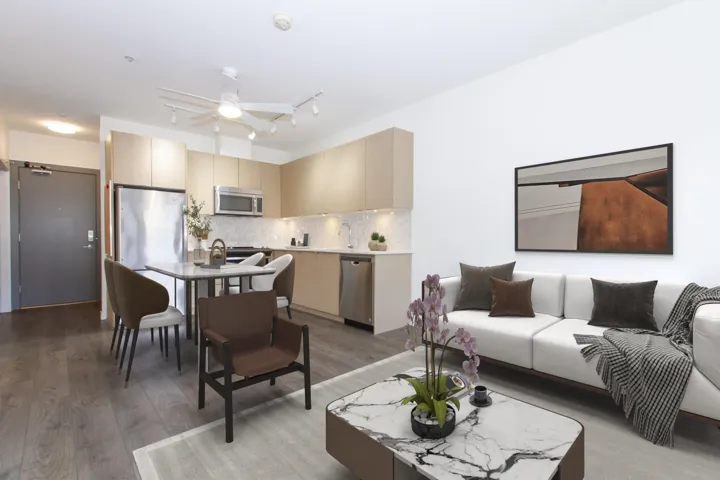 Living area featuring light wood finished floors, a ceiling fan, and rail lighting
