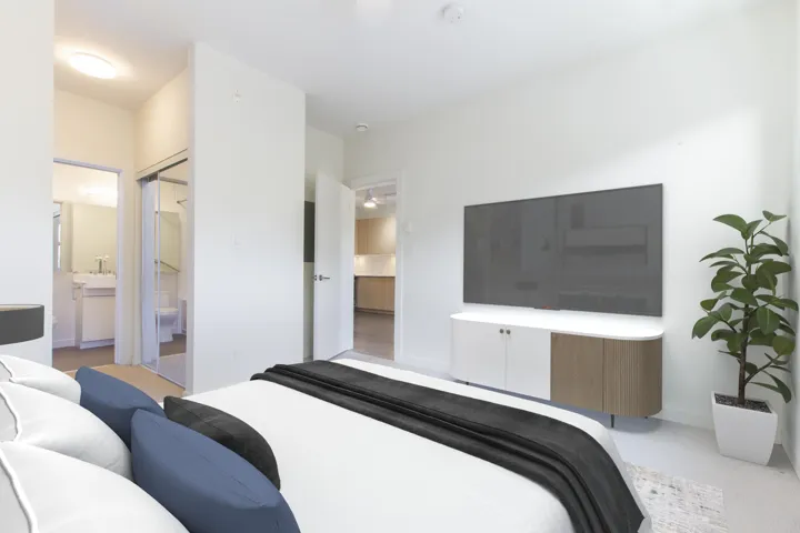 Bedroom with connected bathroom and a sink