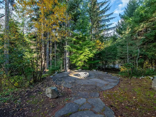 View of yard featuring an outdoor fire pit and a patio