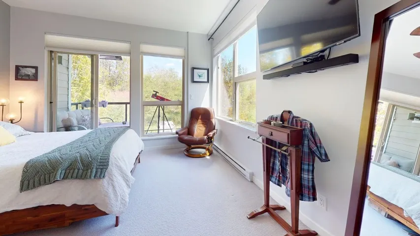 With windows on two sides and a great weather protected outdoor space, walk through his and hers closets and 5 pc. ensuite