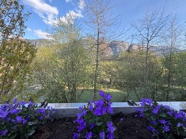 Large deck with Stawamus Chief and surrounding mountain and greenspace views. One of two decks.This one is off Primary bedroom.