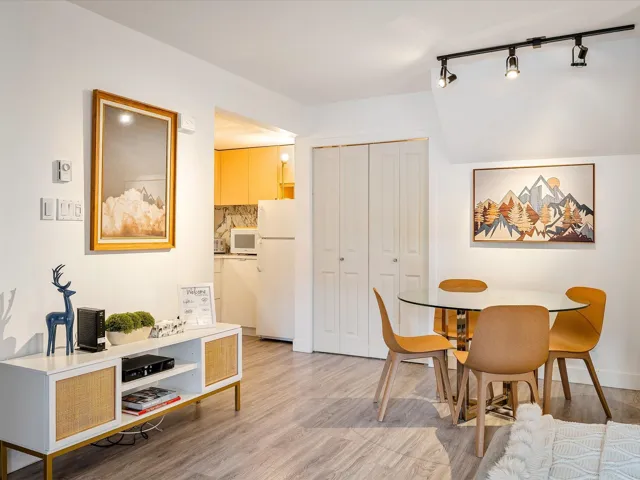Dining area featuring light wood-style floors and baseboards