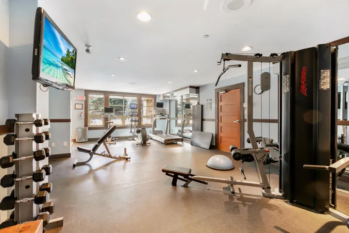 Exercise room featuring baseboards and recessed lighting