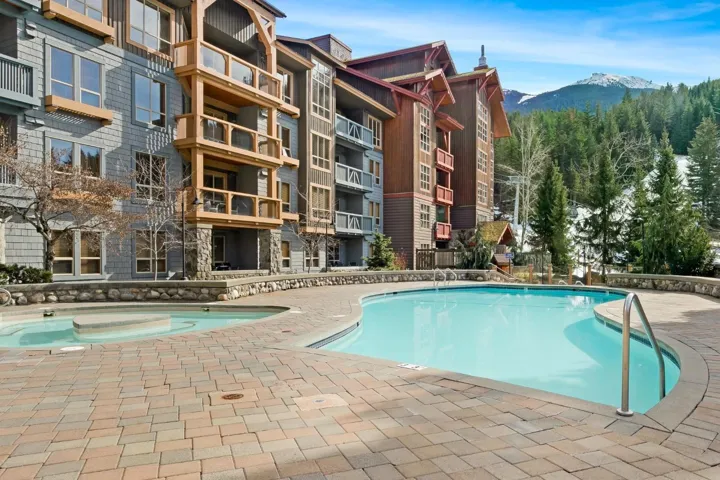 Pool featuring a patio area and a mountain view