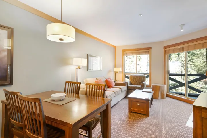 Dining room featuring light carpet