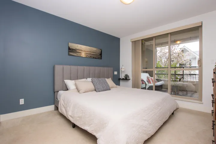 Bedroom with carpet floors and baseboards