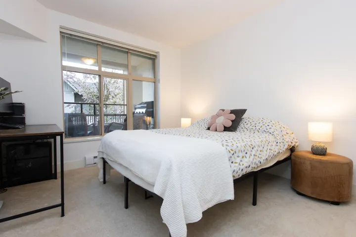Bedroom featuring carpet floors and baseboard heating
