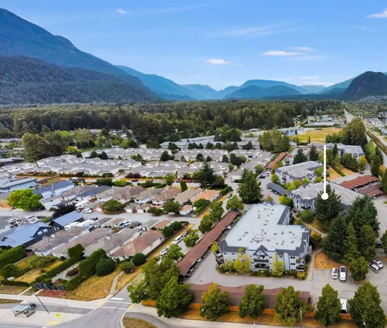 Aerial perspective of suburban area featuring a mountainous background