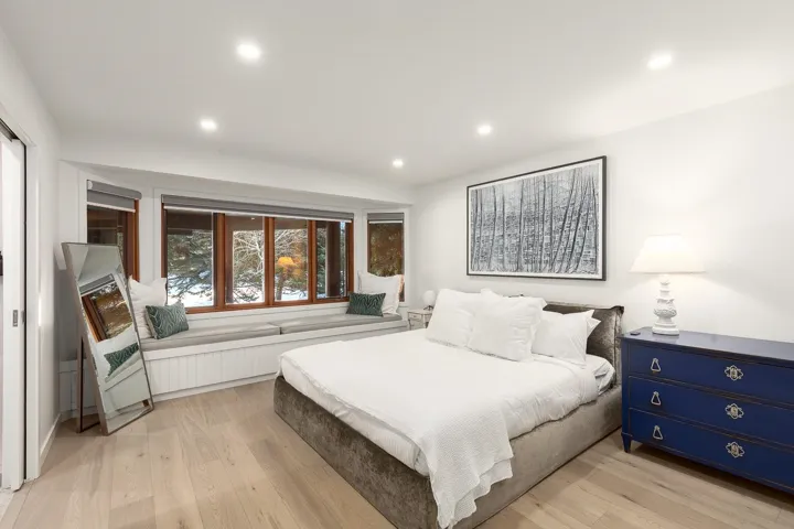 Bedroom with light wood-style floors and recessed lighting